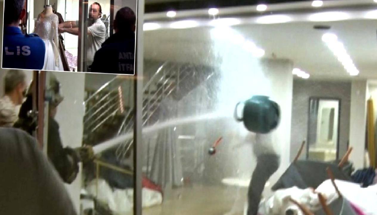 Adam, eşinin mağazasını basıp gelinlikleri yakmaya çalıştı; tazyikli suyla durdurdular!